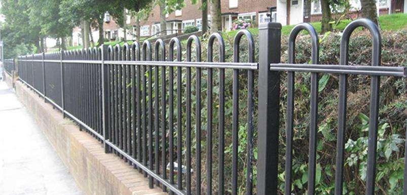 Black railings near pavemnet