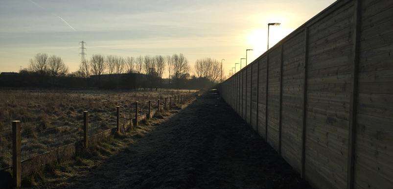 Acoustic Fencing separting walkway